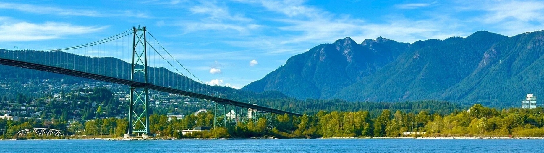 Lions Gate Bridge connecting Vancouver and North Vancouver with North Shore mountains backdrop