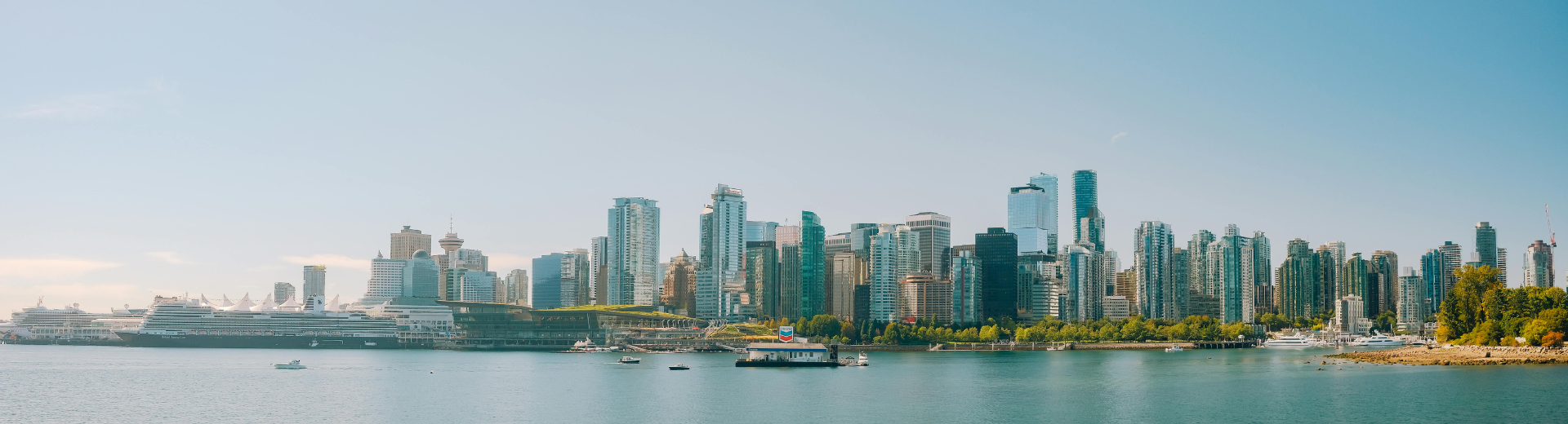 Waterfront skyline in Vancouver, British Columbia, with contemporary high-rise buildings and scenic harbour views symbolizing financial security and long-term growth.