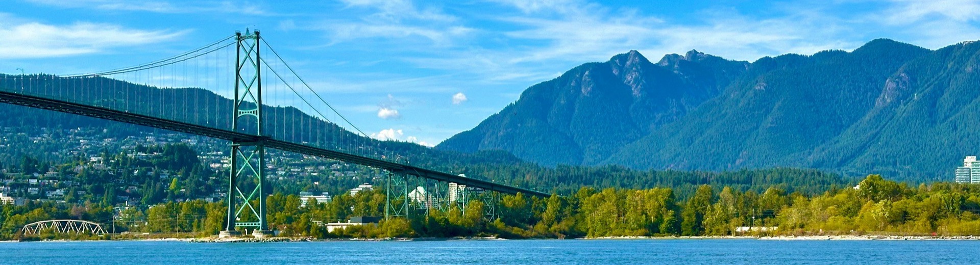 Lions Gate Bridge connecting Vancouver and North Vancouver with North Shore mountains backdrop